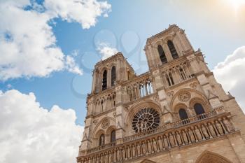 Blue sky and facade of Notre Dame de Paris cathedral, France