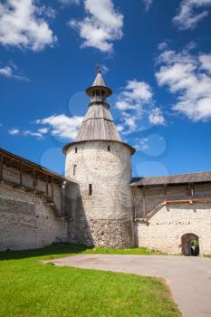 Classical Russian ancient architecture. Stone tower and walls of old fortress. Kremlin of Pskov, Russia