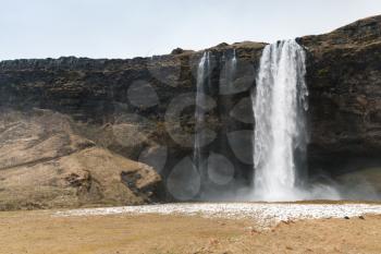 Landscape of Seljalandfoss waterfall, popular natural landmark of Icelandic nature