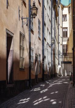 Old narrow street view. Gamla stan, the old town in central Stockholm, Sweden