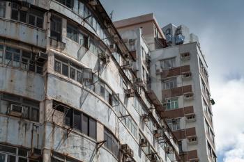 Grungy Asian urban architecture background, old block of flats of Hong Kong