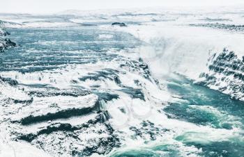 Gullfoss waterfall in winter, popular natural landmark of Iceland, blue toned photo
