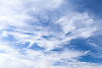 Blue sky at daytime with windy cirrus clouds. Natural background photo texture