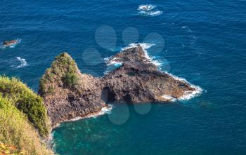 Seaside landscape of Portugal. Coastal rocks of Madeira island, Bridal Veil Falls viewpoint