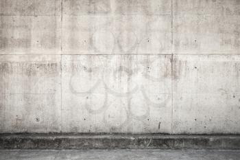 Abstract empty industrial architectural background, gray concrete wall and floor, front view