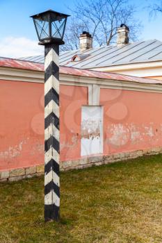Retro stylized street light pole in Russian countryside