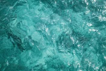 Blue ocean water surface, background photo texture, top view