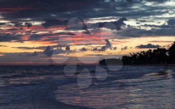 Dramatic sky just before the sunrise over Atlantic Ocean coast, Bavaro beach, Hispaniola Island. Dominican Republic