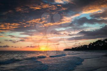Colorful dramatic sunrise over Atlantic Ocean. Bavaro beach, Hispaniola Island. Dominican Republic