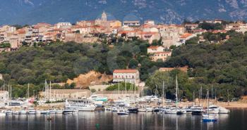 Corsica island, France. Porto-Vecchio town, coastal cityscape with moored yachts