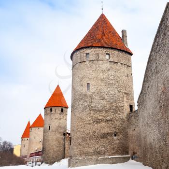 Ancient stone fortress walls with towers in row. Tallinn, Estonia