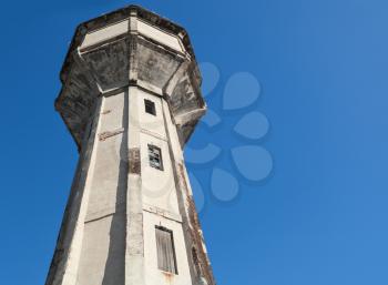 Old abandoned water tower above blue sky. Tallinn, Estonia