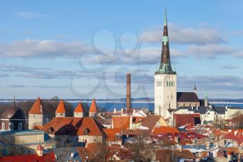Cityscape panorama of Old Tallinn, Estonia. Houses with red roofs and church St. Olaf