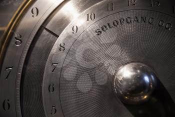 Old mechanical world clock deal, close up photo, selective focus, text in Danish means sunrise and sunset time