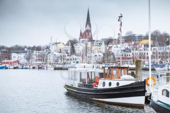 Pleasure boats moored in port of Flensburg, Germany in winter season