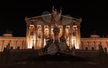 Pallas Athene Fountain at night. Located in front of the Austrian Parliament Building, was erected between 1893 and 1902 by Carl Kundmann, Josef Tautenhayn, Hugo Haerdtl