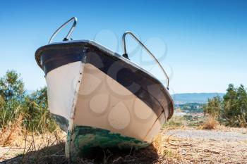 White fishing row boat on the coast. Summer landscape of Zakynthos island, Greece