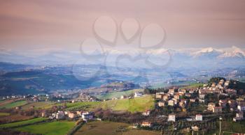 Italian countryside, rural panoramic landscape. Province of Fermo, Italy. Villages and fields on hills