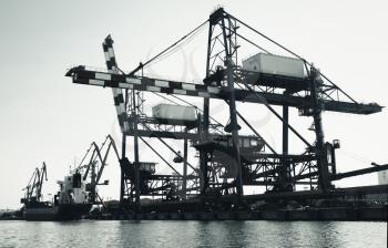 Gantry cranes in Port of Burgas, Black Sea coast, Bulgaria. Vintage toned black and white photo