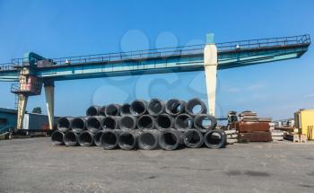 Stacked cable bundles lay near bridge crane in Burgas port, Bulgaria