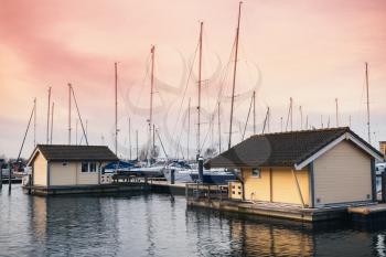 Sailing yachts and floating houses in Muiderzand marina, Amsterdam, Netherlands