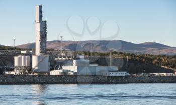 Norwegian oil plant, coastal industrial landscape with chimneys