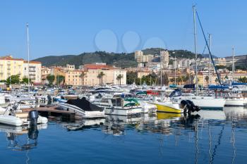 Ajaccio port. Coastal cityscape with sailing yachts and pleasure motor boats moored in marina, Corsica island, France