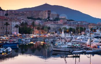 Ajaccio Marina at summer evening. Pleasure yachts and motor boats moored in old port of Ajaccio, the capital of Corsica island, France