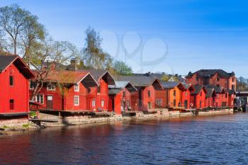 Historical Finnish town Porvoo. Old red wooden houses in a row on river coast