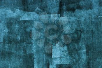 Concrete wall with dark blue paint layer, grungy background photo texture