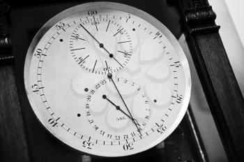 Vintage clock-face, closeup black and white photo of ancient chronometer
