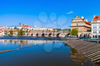 Old Prague in summer day, dam on Vltava river. Czech Republic