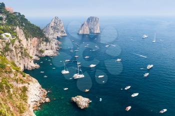 Capri island, Italy. Mediterranean Sea. Coastal landscape with rocks and pleasure yachts