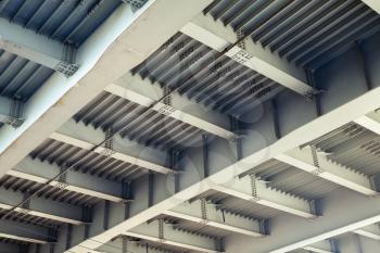 Abstract steel construction with beams and bolts junctions