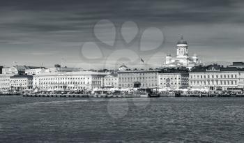 Monochrome Helsinki cityscape. Central quay, building facades and dome of the main city cathedral
