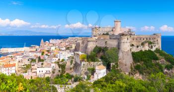 Landscape of old town Gaeta with ancient castle on coastal rock, Italy