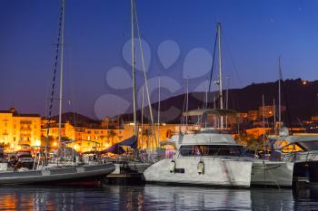 Pleasure yachts and motor boats moored in old port of Ajaccio, the capital of Corsica island, France. Night photo
