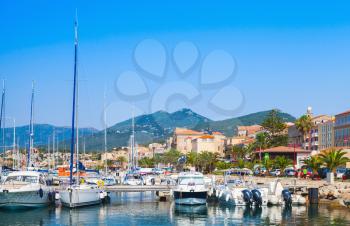 Pleasure motor boats and sailing yachts are moored in marina of Propriano, South Corsica, France