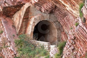Old tunnel portal in red rock