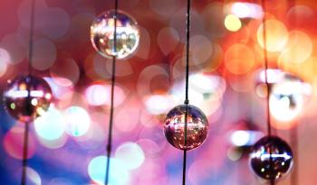 Abstract colorful background with glass spherical design elements of modern chandelier and natural lens bokeh pattern