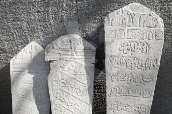 Ancient white headstones with Arabic script carvings. Smyrna, Izmir, Turkey