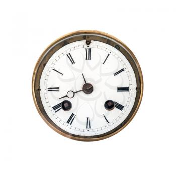 Front view of an ancient clock dial with roman signs isolated on white