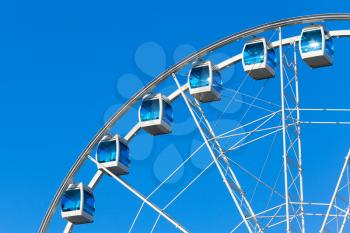 Ferris wheel over blue sky background
