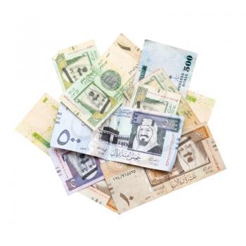 Pile of modern Saudi Arabia money, banknotes isolated on white background close-up photo