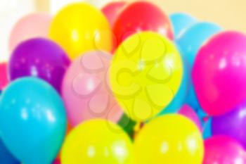 Group of colorful balloons, blurred photo background with vintage tonal photo filter effect, retro style
