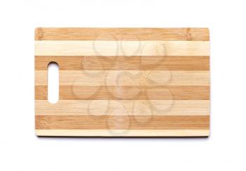 New cutting board made of striped bamboo planks on white table background with shadow