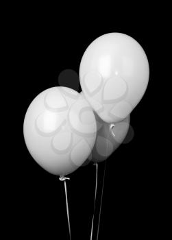 Three white balloons isolated on black background