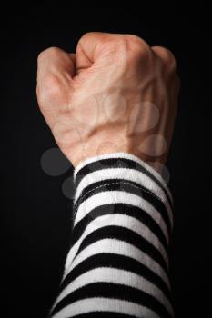 Closeup photo of sailor fist  on a dark background