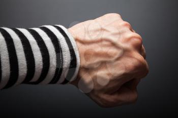Close up photo of sailor fist  on a dark background
