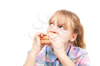 Little blond girl eats burger. Photo Isolated on white background